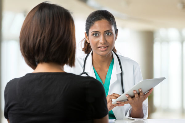 A Health Total clinician reviewing a plan with a client